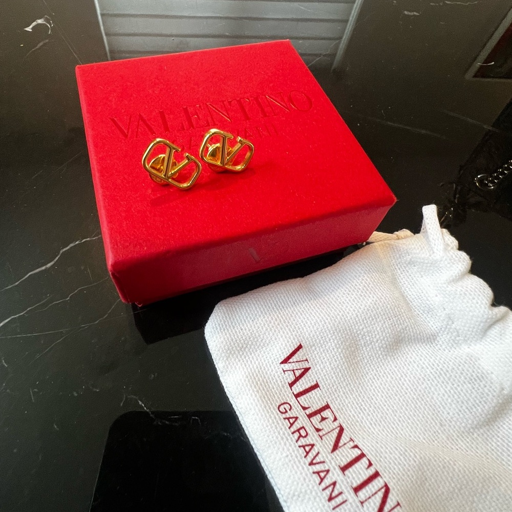 Valentino Garavani Gold Logo Stud Earrings on Red Box